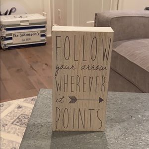 Follow your arrow wherever it points sign.